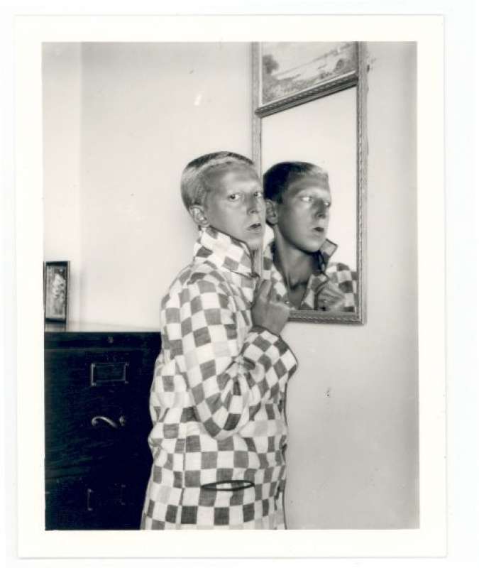 claude cahun self portrait reflected image in mirror checquered jacket 1928. courtesy of the jersey heritage collections