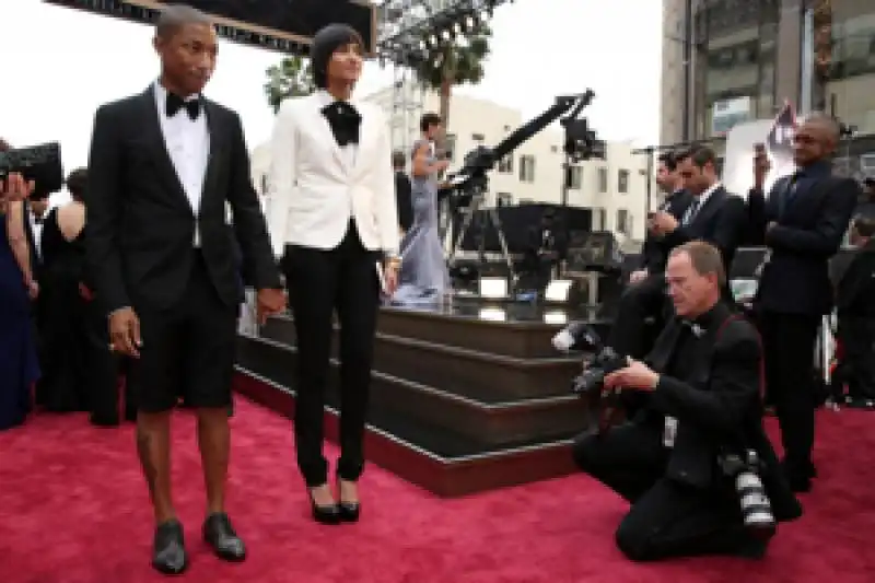 pharrell wearing shorts with wife helen lasichanh 