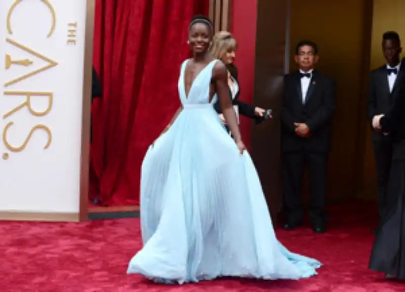 years a slave best supporting actress nominee lupita nyongo in custom made prada she says she chose blue because it reminds me of nairobi so i wanted to have a little bit of home with me 