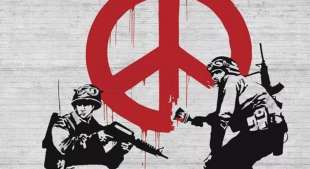 opera di Banksy col simbolo della pace che sanguina