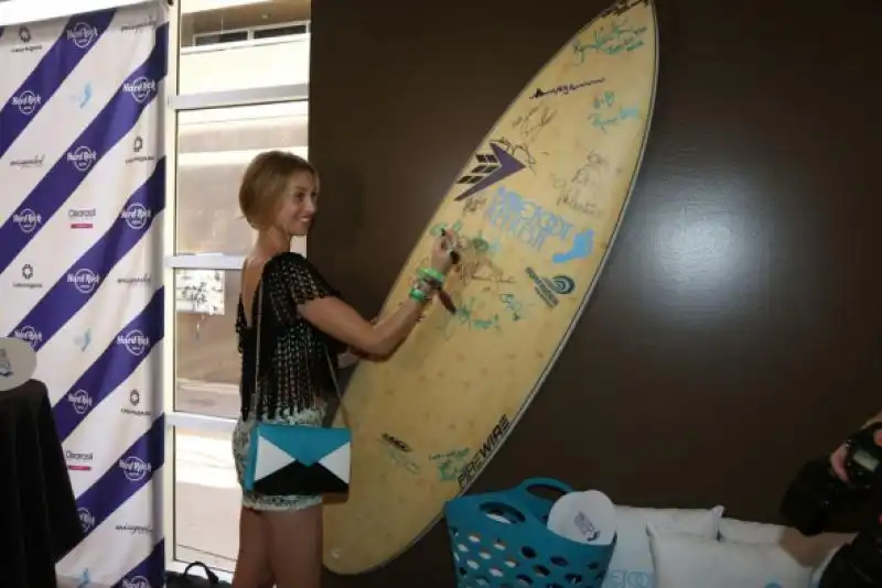 where her former mtv co star whitney port signed a surfboard 