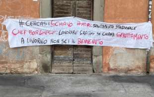 lo striscione a livorno contro alessandro borghese