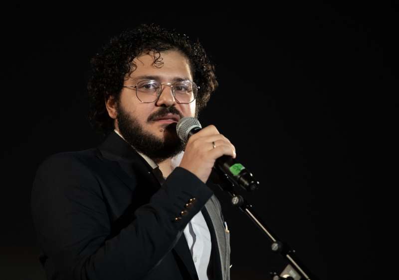 patrick zaki sul palco di piazza maggiore a bologna