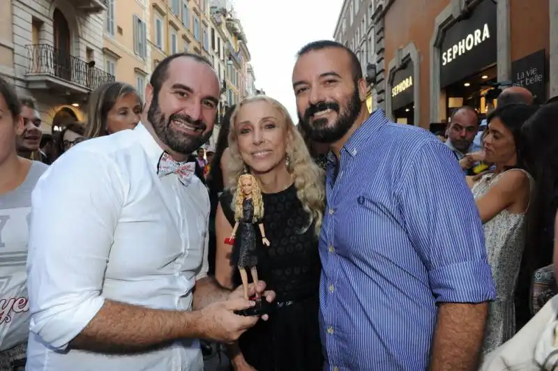 alessandro e giuseppe con la bambolina per franca sozzani