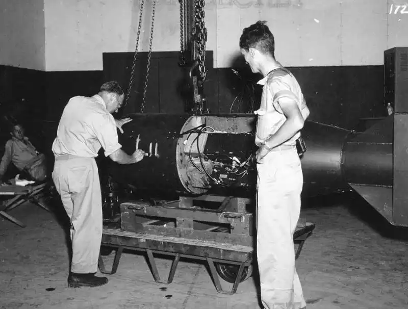 on the left geophysicist and manhattan project participant francis birch marks the bomb unit that would become little boy while norman ramsey who would later win the nobel prize in physics looks on