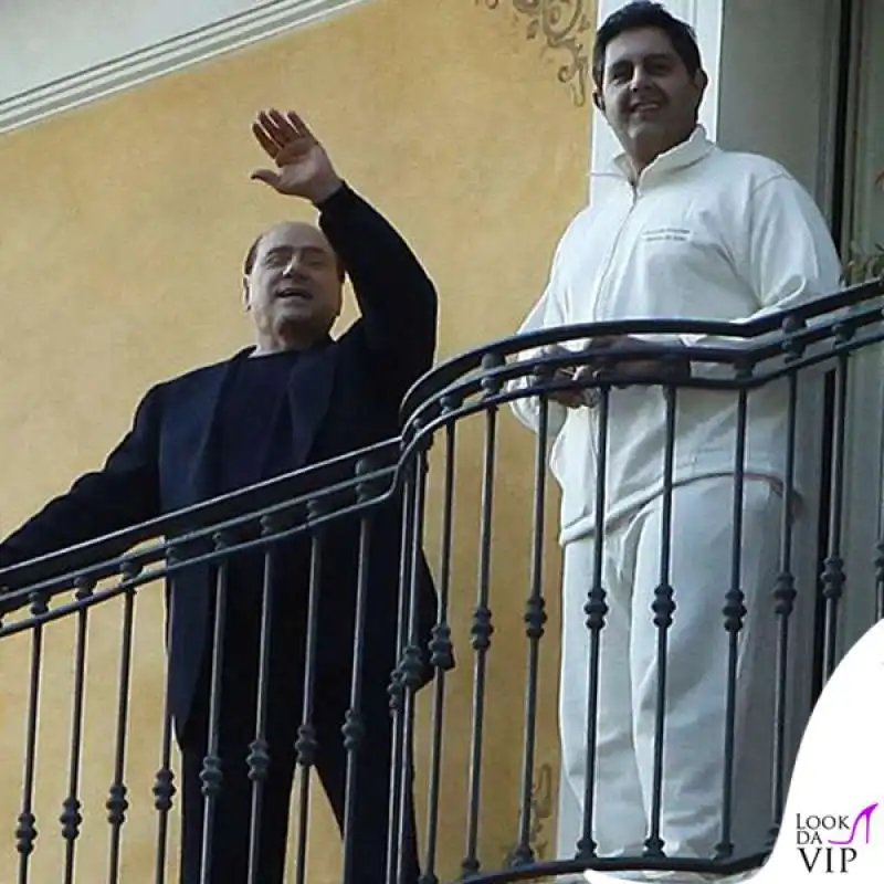 giovanni toti in tuta con berlusconi