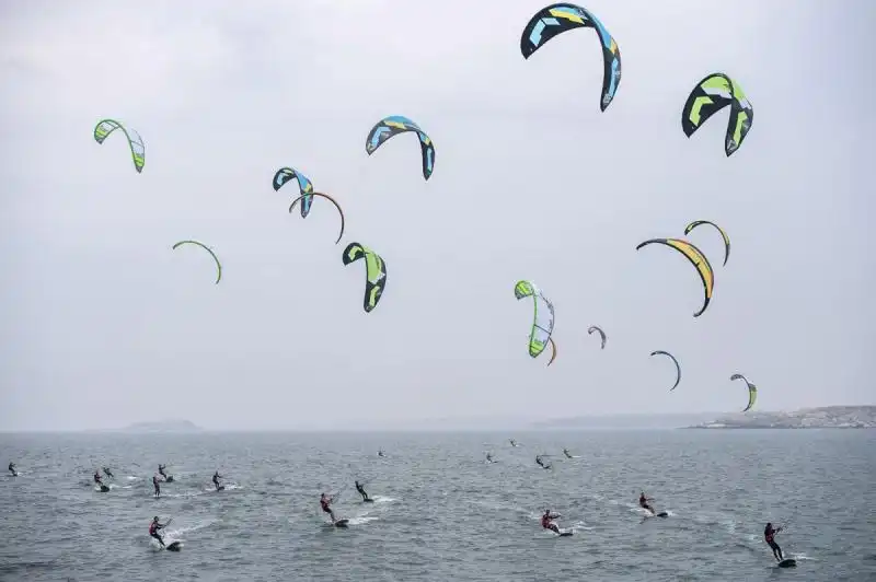 kiteboarders start a day of competition in pingtan china 