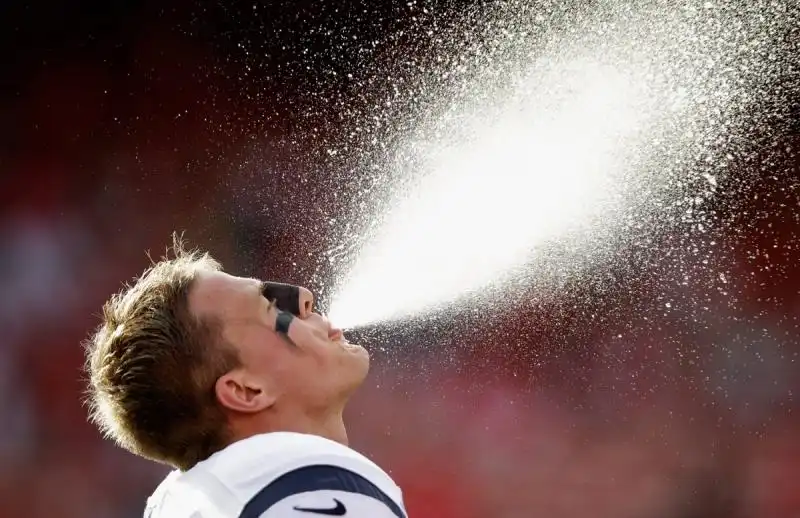 texans player jj watt spits water before a game against the ers in san francisco 