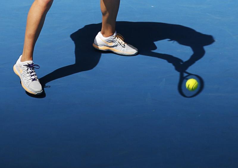 victoria azarenka returns a serve at the australian open