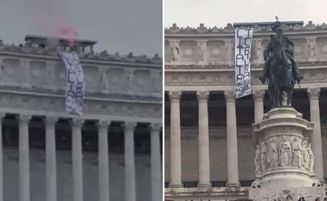 alfredo cospito altare della patria striscione fumogeno anarchici