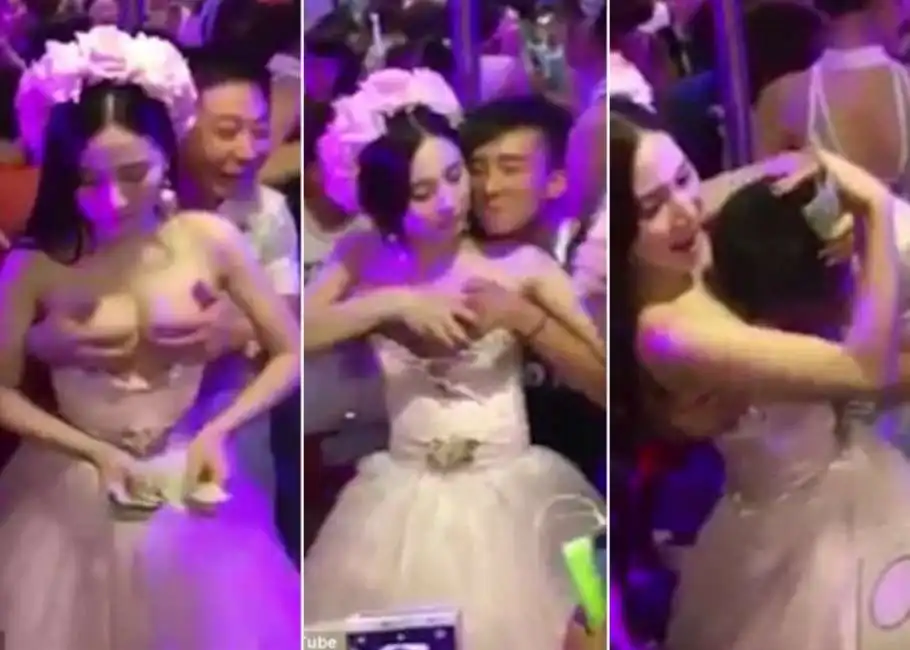 la sposa in cina che si fa palpare il seno al matrimonio