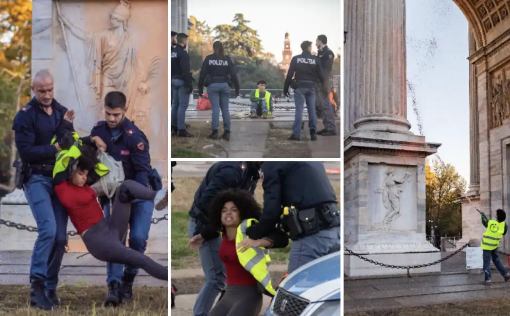 attivisti di ultima generazione imbrattano l arco della pace a milano